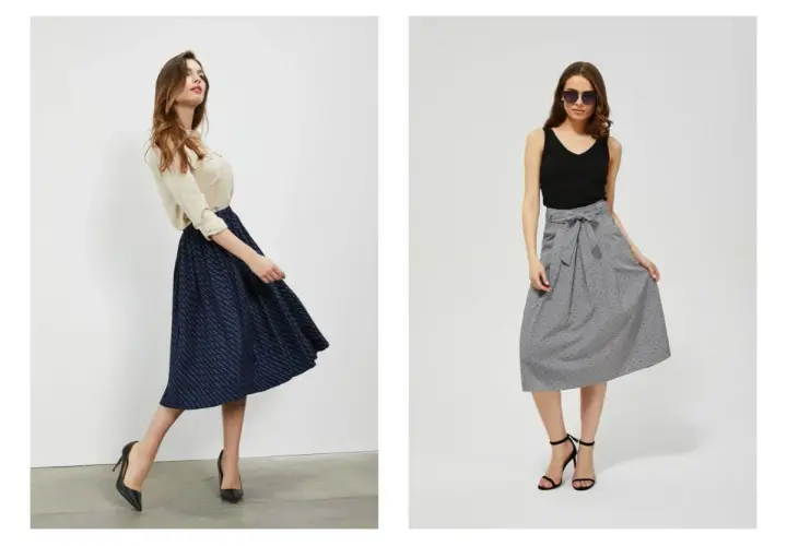 Dwie kobiety prezentują eleganckie spódnice midi. Odpowiedź na pytanie: dress code co to?