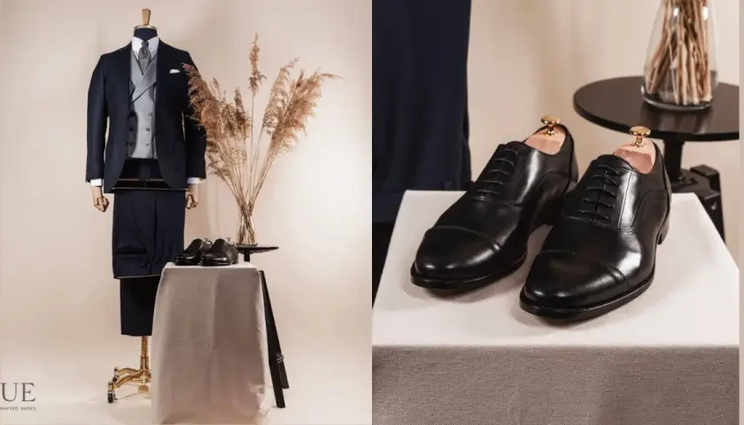 Elegancki czarny garnitur i klasyczne czarne oksfordy. Idealne połączenie, by zadać sobie pytanie: jakie buty do czarnego garnituru pasują najlepiej?
