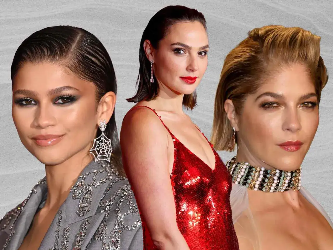 Trzy kobiety z eleganckimi, włosy zaczesane do tyłu damskie. Zendaya w błyszczącym żakiecie, Gal Gadot w czerwonej sukience, Selma Blair w ozdobnym naszyjniku.